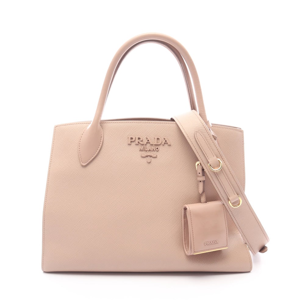 Prada Saffiano Monochrome 2Way: Authentic and authenticated Prada Saffiano Cuir C Monochrome 2WAY handbag in pink beige saffiano leather. Model 1BA156. Includes shoulder strap, mirror pouch, and guarantee card.