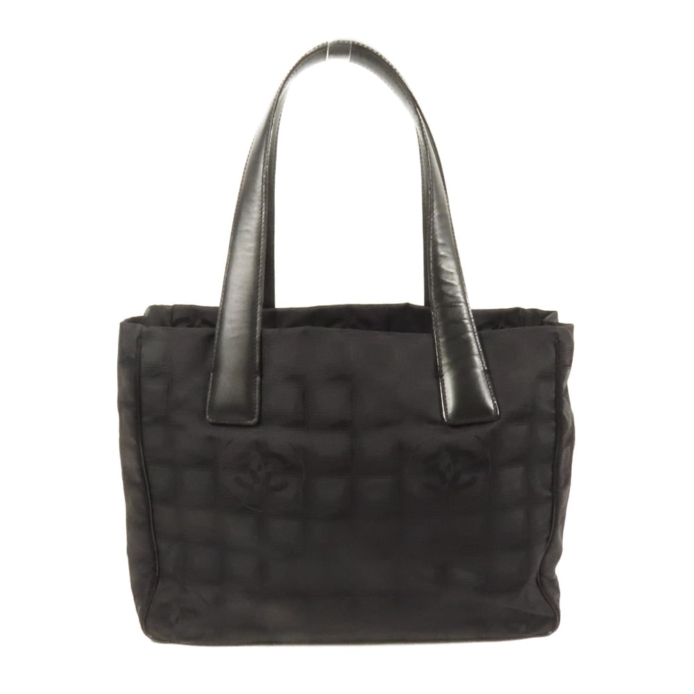Chanel Nylon Hand Bag Black: Authentic and authenticated Chanel hand bag in black nylon. Product #8819389. Includes hologram sticker. Approx. 28 x 22 x 12 cm with 44 cm handles.