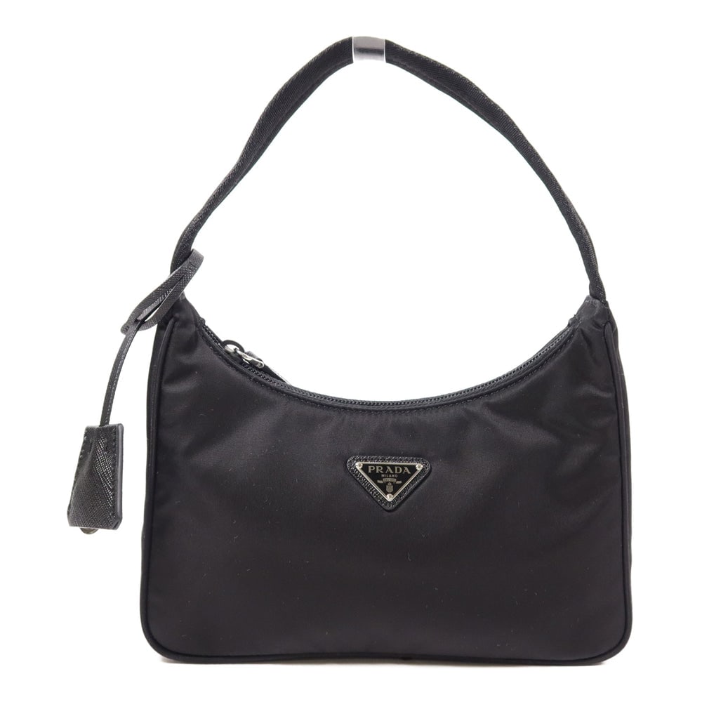Prada Re-Edition 2000 Mini Handbag Black: Black nylon mini handbag with storage bags. Approx. 22.5 x 12 x 6 cm with 33 cm handle. Re-Edition 2000 style. Authentic and authenticated.