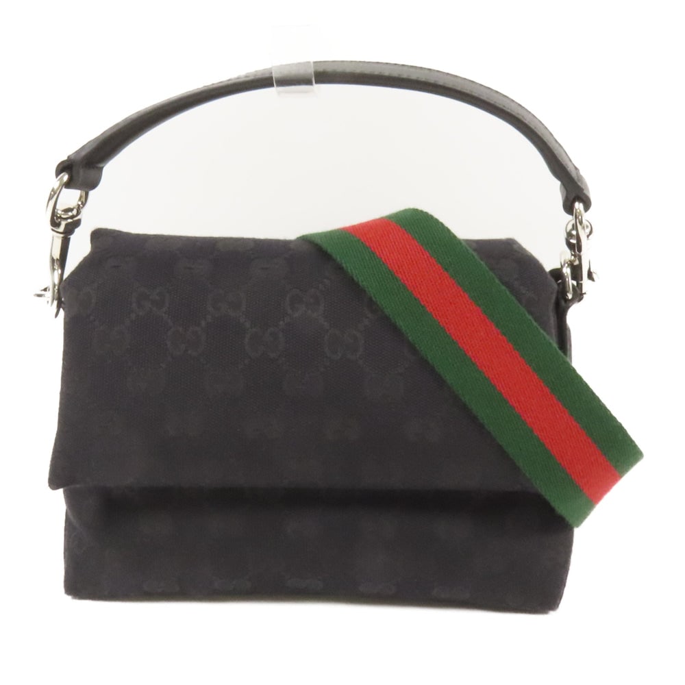 Gucci GG Canvas Crossbody Black: Black GG canvas Gucci crossbody 2-way shoulder bag with storage bags and shoulder strap. Approx. 20 x 16 x 7 cm; handle 36 cm; strap 119 cm. Product no. 213317. Authentic and authenticated.
