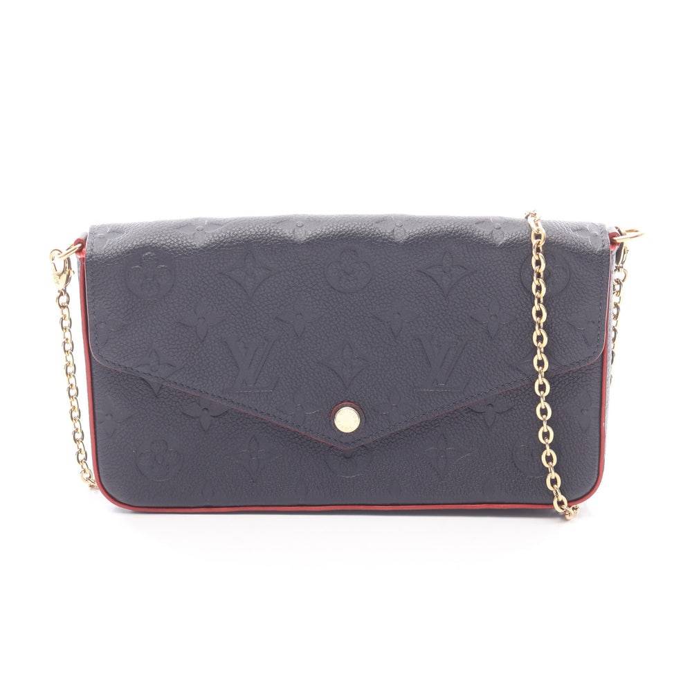 LV Pochette Felicie Empreinte Navy Red: Navy and red leather Pochette Felicie chain wallet. Includes coin purse and card case. Approx. 21.5 x 12 x 3 cm; strap 115 cm. Model M64099, product no. FY5119. Authentic and authenticated.