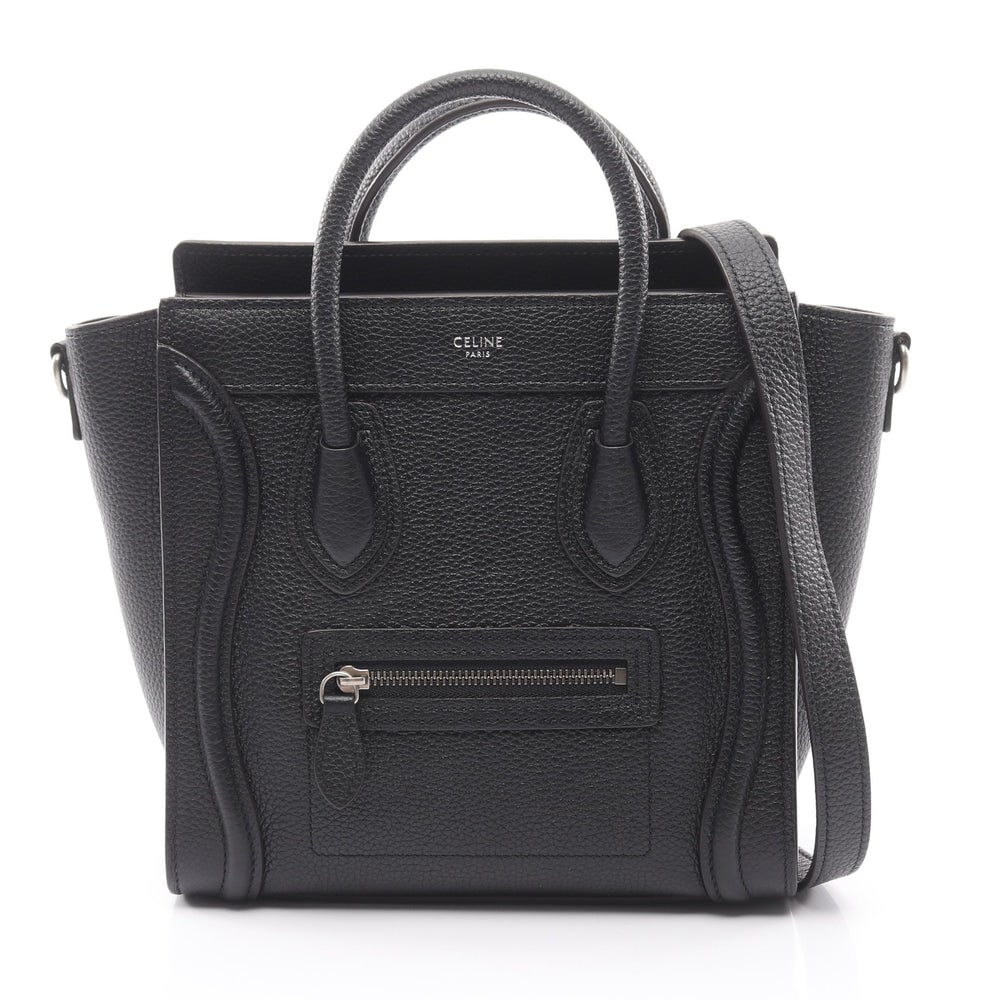 Celine Luggage Nano Black: Black leather Celine Luggage Nano shopper 2-way handbag with shoulder strap. Approx. 28 x 20 x 9 cm; handle 29 cm; strap 121 cm. Model 189243. Authentic and authenticated.