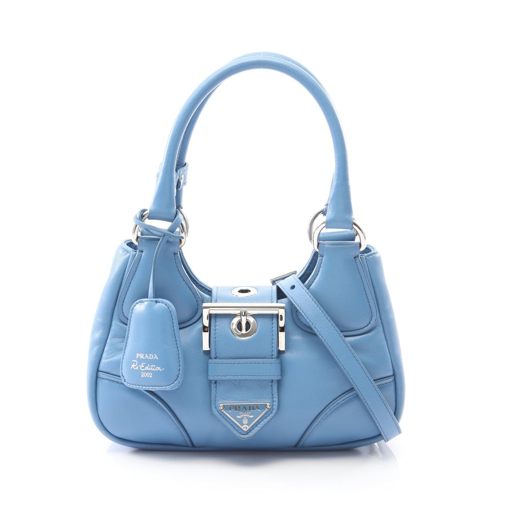 Prada Moon 2-Way Blue: Blue leather Prada MOON 2-way handbag with shoulder strap and crochet key ring. Approx. 22 x 13 x 7.5 cm; handle 34.5 cm; strap 103-113 cm. Model 1BA381. Authentic and authenticated.