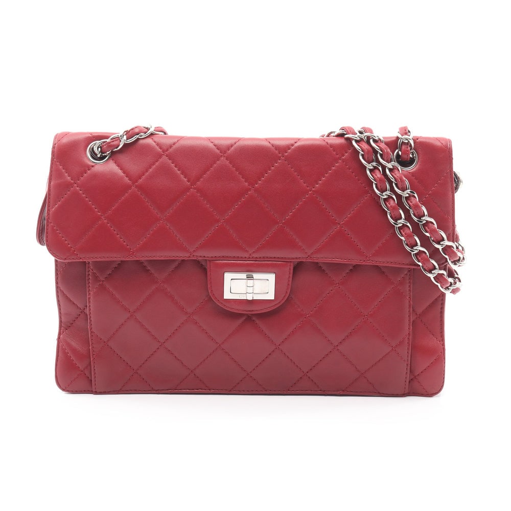 Chanel Matelasse W Chain Red: Red lambskin Chanel Matelasse W chain shoulder bag with silver hardware and serial seal. Approx. 32 x 22 x 3.5/2 cm; double strap 63 cm; single strap 101 cm. Authentic and authenticated.