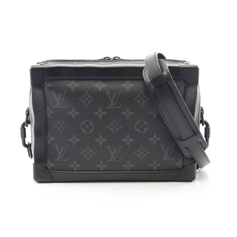 LV Soft Trunk Eclipse Black: Black Monogram Eclipse PVC leather Soft trunk shoulder bag. Approx. 24 x 17.5 x 9.5 cm; strap 125-140 cm. Model M44730, product no. DU3189. Authentic and authenticated.
