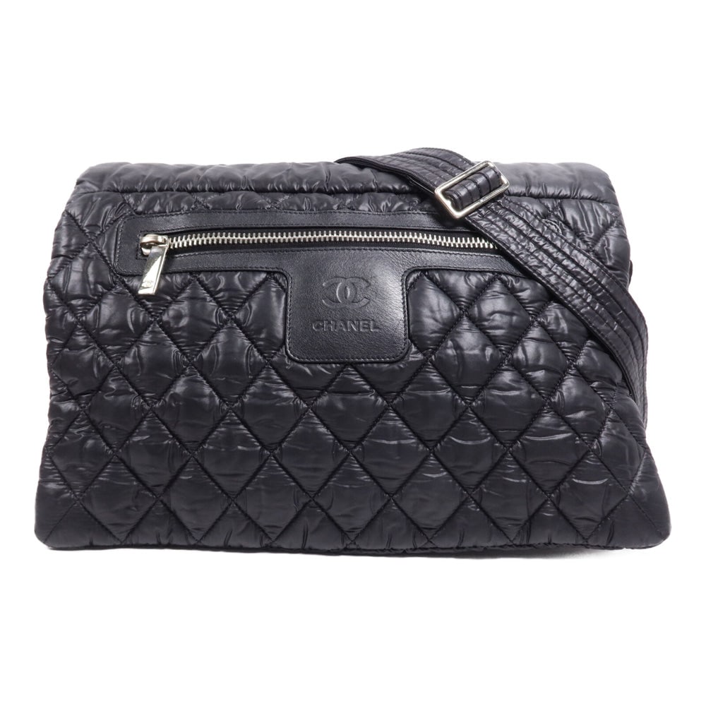 Chanel Coco Cocoon Messenger Bag: Black nylon messenger shoulder bag with SHW; includes storage bag hologram sticker and guarantee; W34.5 x H22 x D9 cm; strap 72.5-139 cm. Authentic and authenticated.
