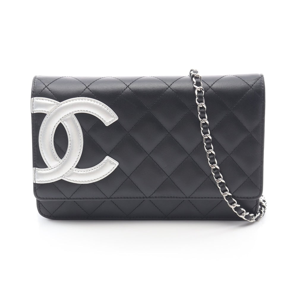 Chanel Cambon Line Chain Wallet: Black and silver leather chain wallet with silver hardware; serial seal included; H12 x W19 x D3 cm; strap 130 cm. Authentic and authenticated.