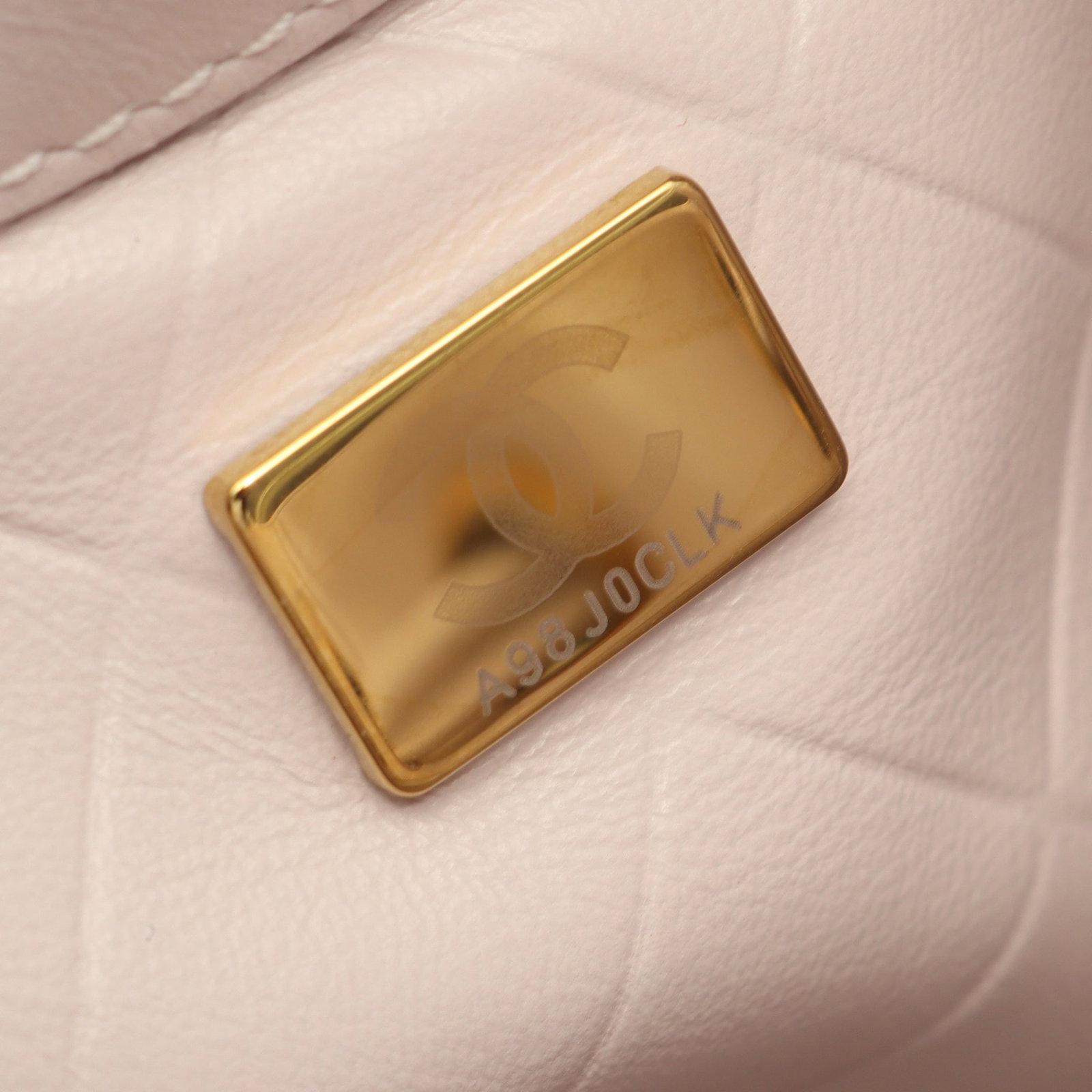 Chanel Bucket Bag Light Pink: Light pink leather bucket bag with chain strap.