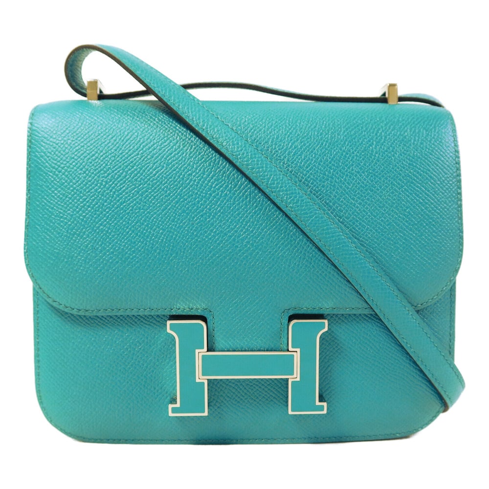 Hermes Constance Mini Blue Paon: Blue Paon Epsom leather mini shoulder bag. Includes box and storage bags. 18.5 x 14.5 x 5 cm.