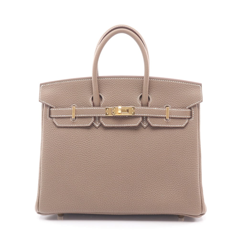 Hermes Birkin 25 Etoupe: Gray brown togo handbag with gold hardware. Includes padlock keys and crochet. 25 x 20 x 13 cm.
