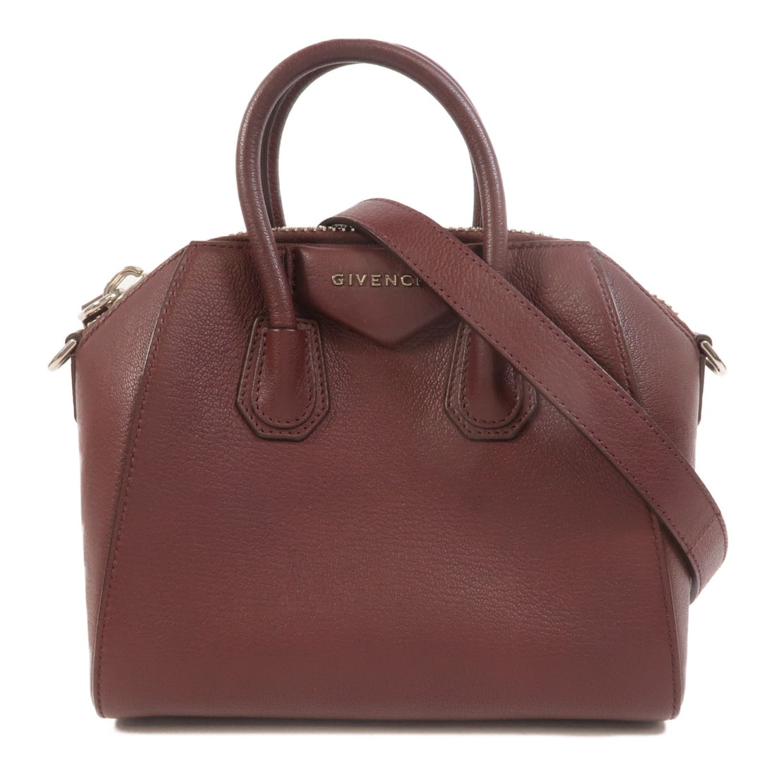 Givenchy Mini Antigona 2WAY Bag: Authentic and authenticated Givenchy Mini Antigona 2 Way shoulder bag in burgundy calfskin. Product no. 3CC0156. Approx. 21.5W x 19H x 12.5D cm with 28 cm handle and 109-129 cm strap. Includes