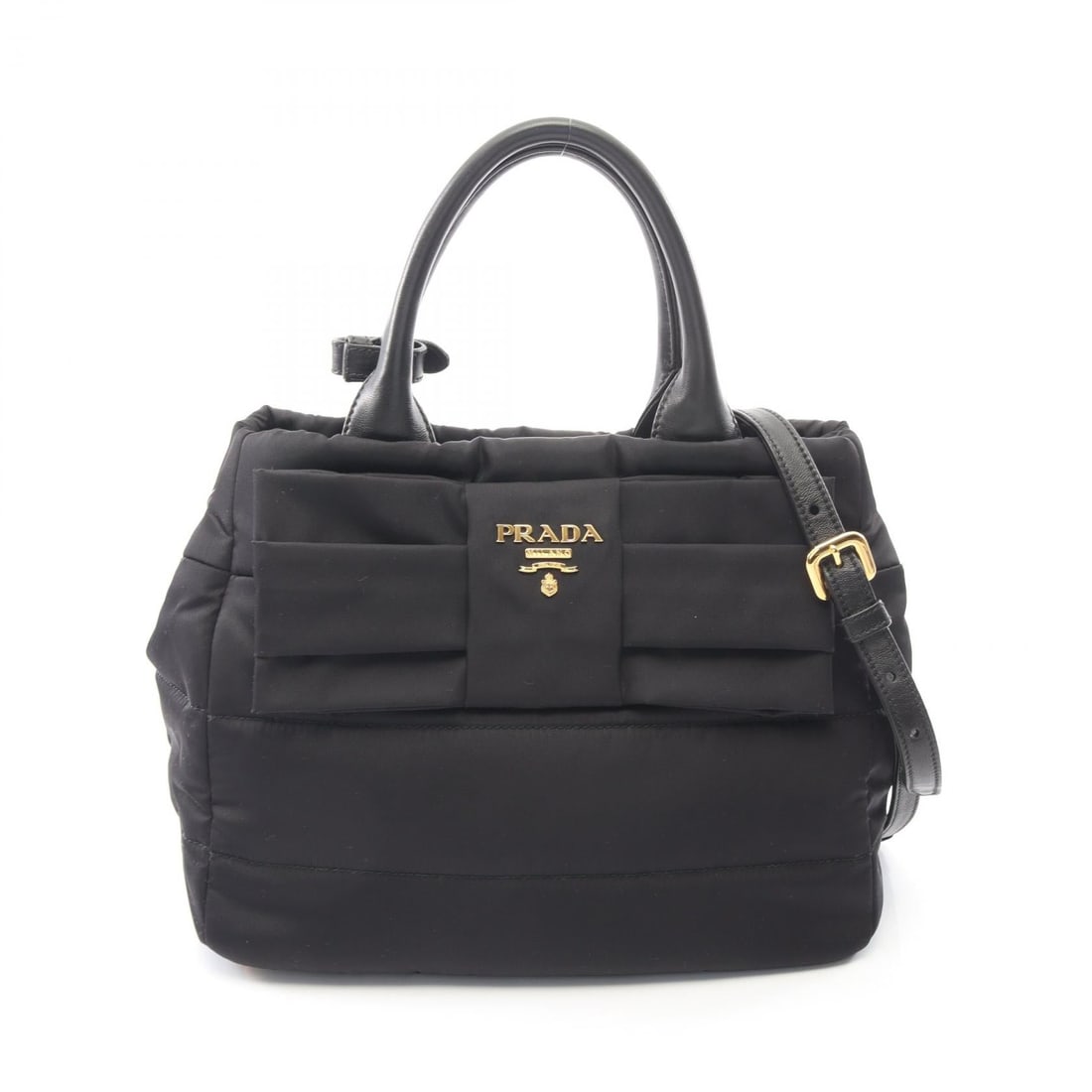 Prada Tessuto Bomber 2WAY Bag: Authentic and authenticated Prada TESSUTO BOMBER Ribbon 2WAY handbag in black nylon and leather. Model 1BG005. Approx. 22H x 26/29W x 15D cm with 34 cm handle and 108-118 cm strap. Includes strap,