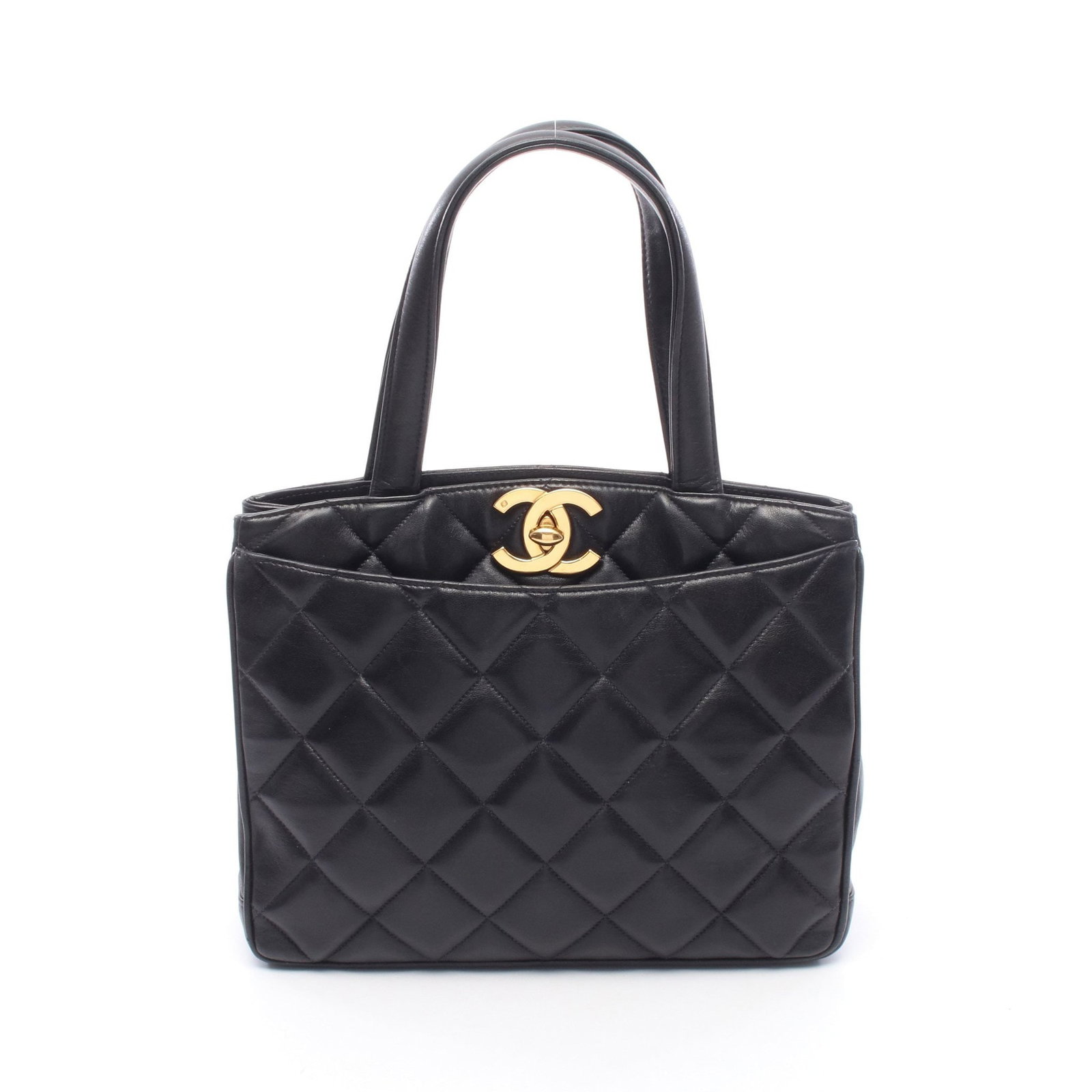 Chanel Turn Lock Handbag Navy: Authentic and authenticated Chanel Matelasse turn lock tote handbag in dark navy lambskin with gold hardware. Approx. 23H x 28W x 8D cm with 39 cm handle. Includes serial seal.