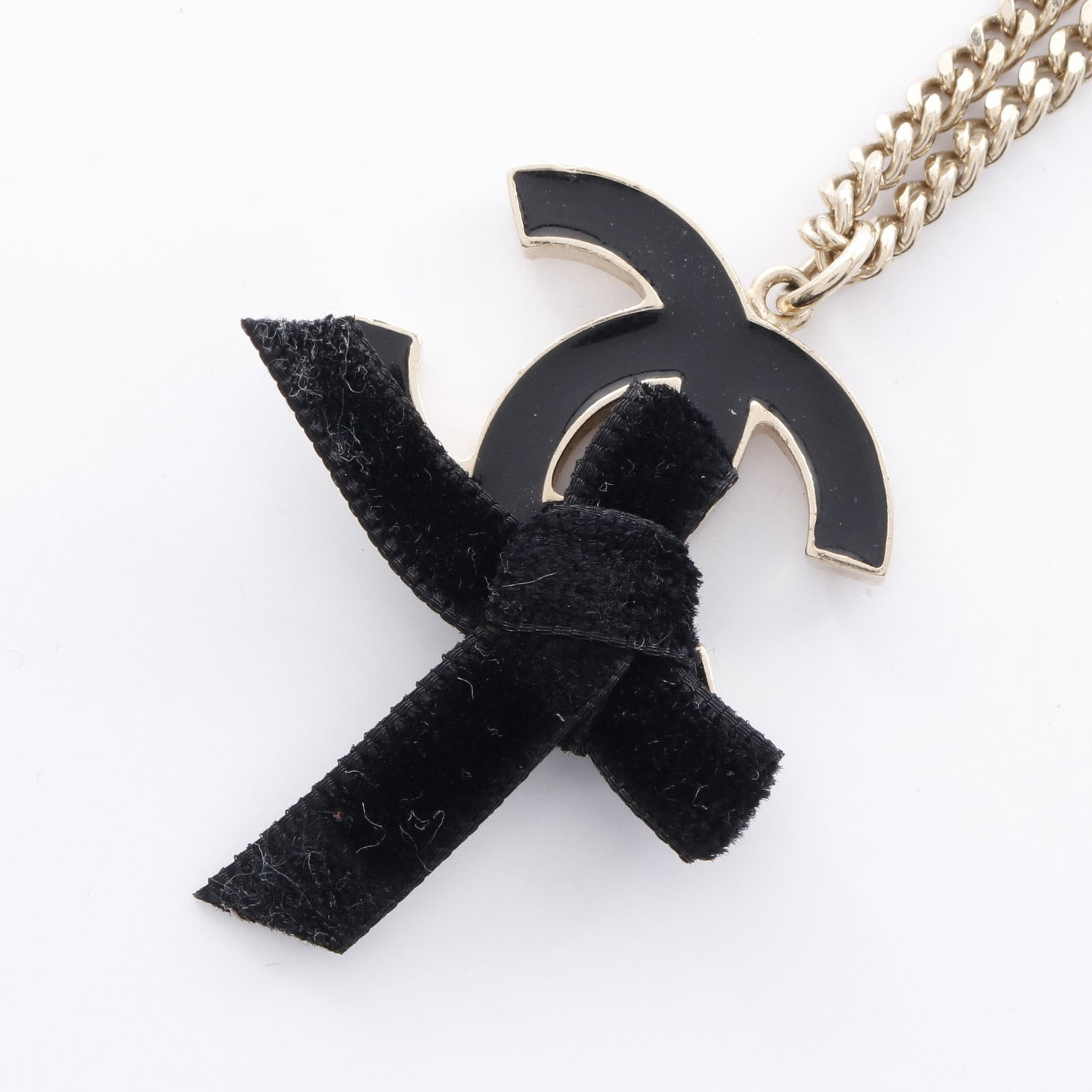 Chanel Ribbon Coco Mark Necklace: Coco Mark Ribbon necklace in gold plated finish.