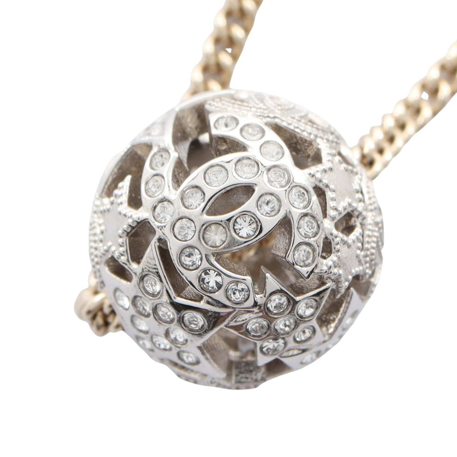 Chanel Coco Mark Star Necklace: Coco Mark Star necklace in silver and gold tone with clear rhinestones.
