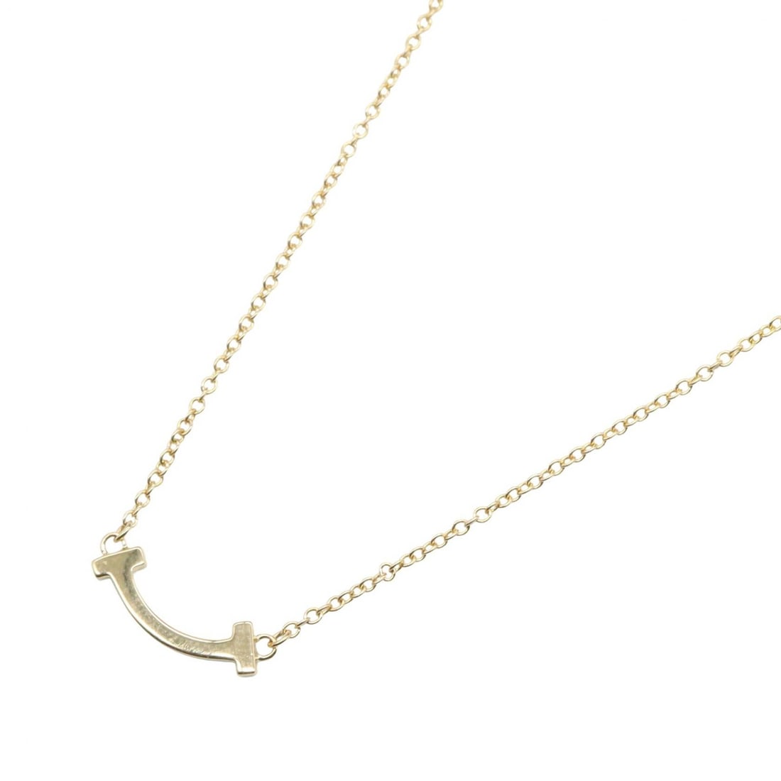 Tiffany T Smile Mini Necklace: T Smile Mini necklace in K18 yellow gold.