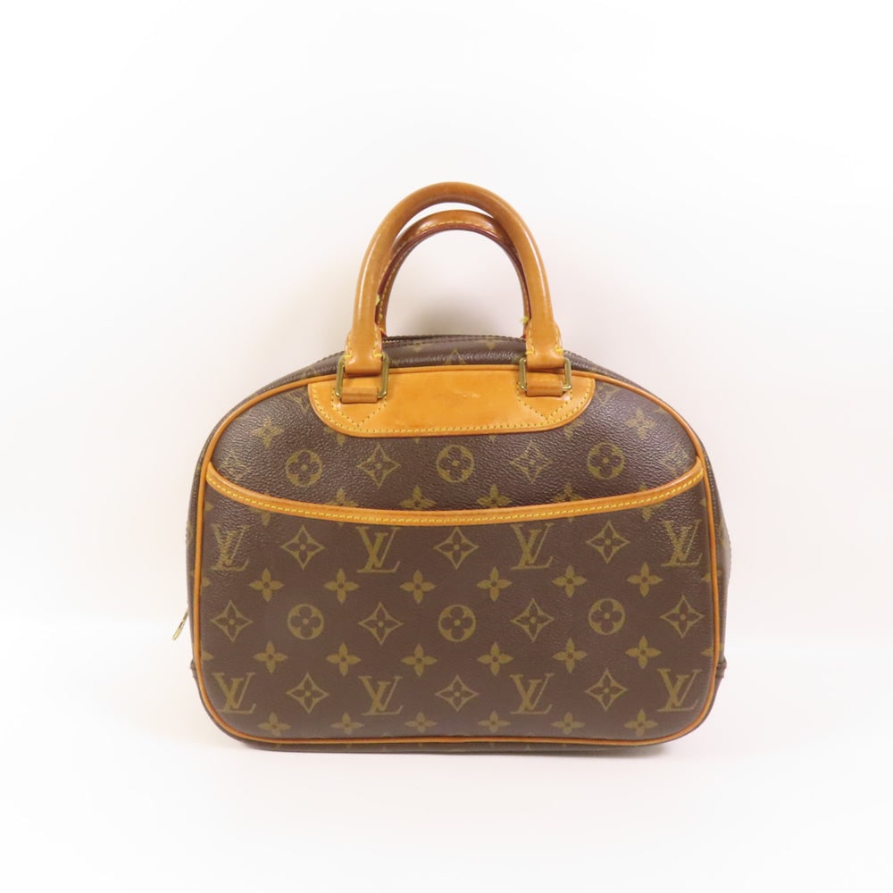Louis Vuitton Trouville Monogram Bag: Authenticated genuine Louis Vuitton Trouville hand bag in brown Monogram PVC coated canvas with gold-tone hardware. Includes storage bags. Product no. BA0087. Approx. W28 x H20 x D11 cm.