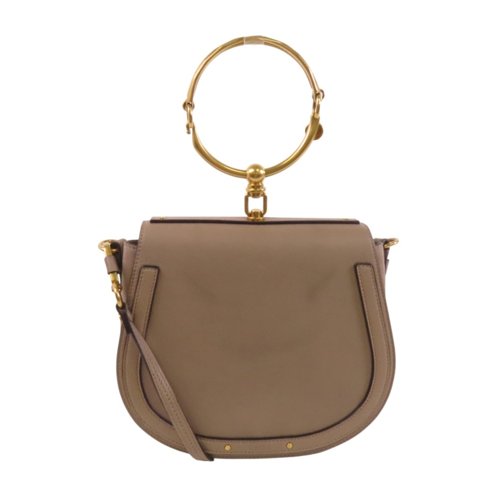 Chloe Nile Gray Shoulder Handbag: Authentic and authenticated Chloe Nile handbag shoulder bag in gray calfskin. Product no. 03.17.70.66.6. Approx. 24W x 20.5H x 8.5D cm with 31 cm handle and 106-119.5 cm strap. Includes storage bags,