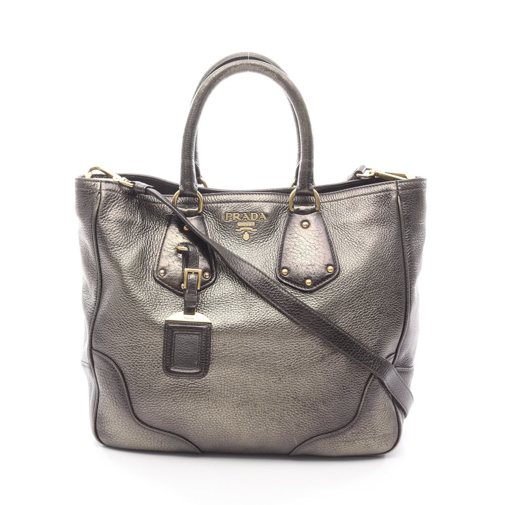 Prada Leather 2Way Khaki Brown: Prada Handbag 2Way. Color: Khaki Brown. Material: Leather. Size: 38/31 X 29 X 12 Cm. Handle: 35 Cm. Strap: 113-123 Cm. Includes: Shoulder Strap, Name Tag.