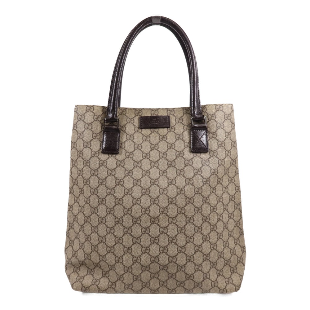 Gucci Brown Coated Canvas Tote Bag: Authentic and authenticated Gucci tote bag in brown PVC coated canvas. Product no. 205141. Approx. 29W x 33H x 13D cm with 43.5 cm handle. No accessories listed.