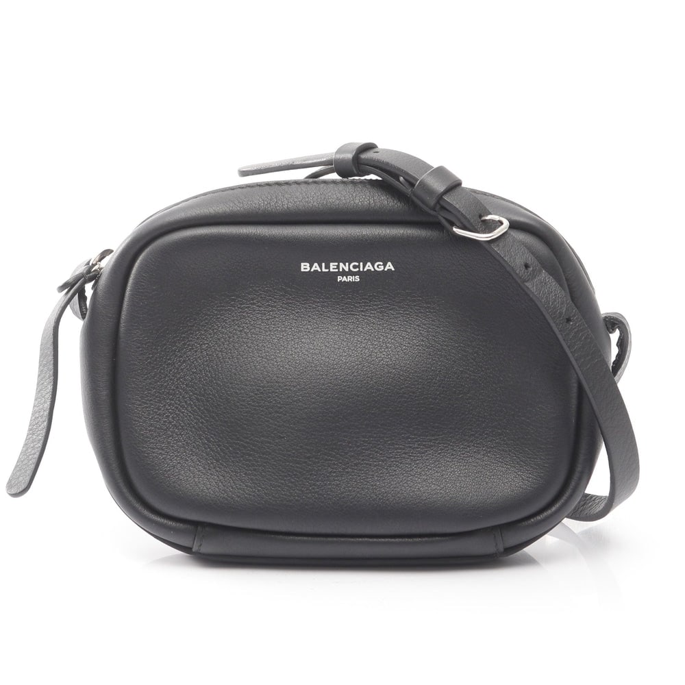 Balenciaga Everyday Camera XS Bag: Authentic and authenticated Balenciaga Everyday Camera Bag XS in black leather. Model 489809. Approx. 12H x 18W x 3.5D cm with 122-132 cm strap.