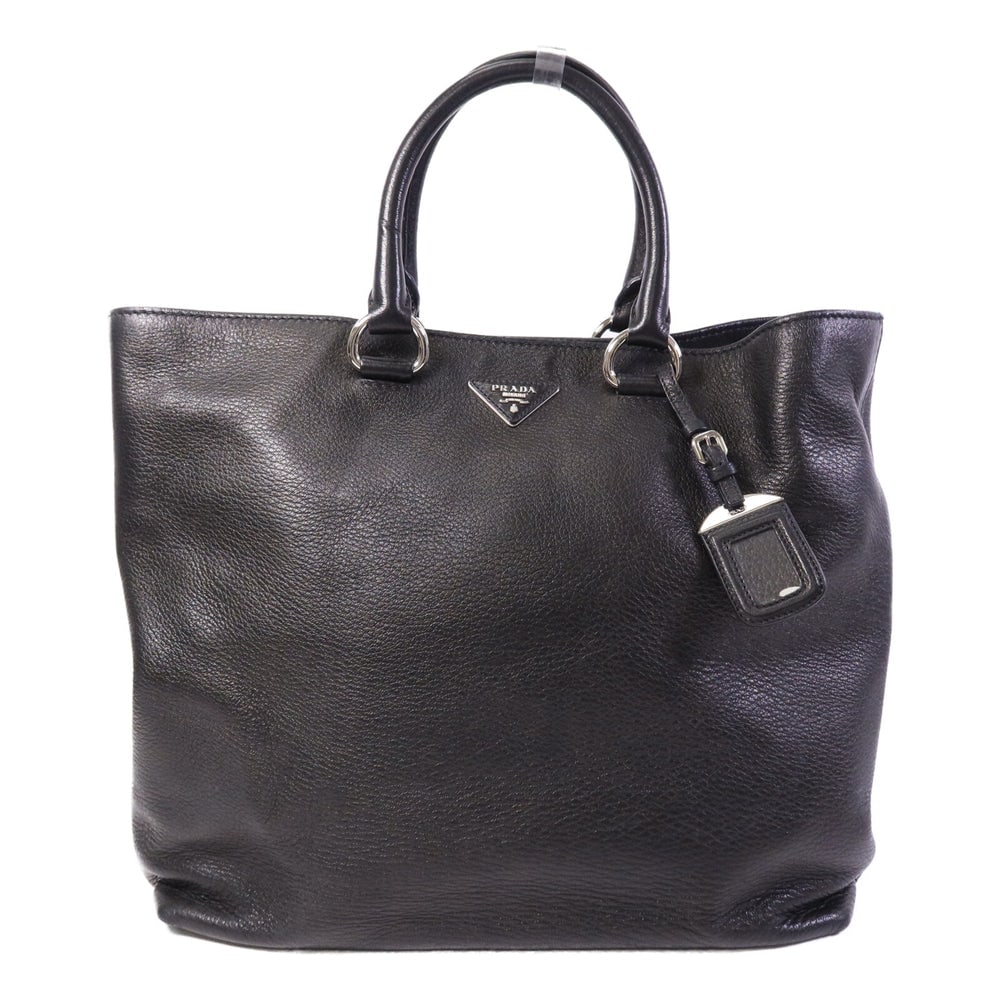 Prada Vitello Phenix Tote Black: Authentic and authenticated Prada Vitello Phenix tote bag in black calfskin. Product no. 14/B. Approx. 35-42W x 35H x 12D cm with 36 cm handle. Includes storage bags and name tag.