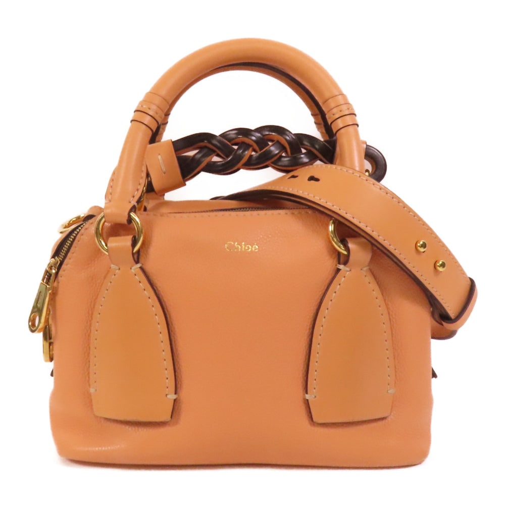 Chloe Small Daria 2WAY Orange: Authentic and authenticated Chloe Small Daria 2way shoulder bag in orange calfskin. Product no. 2121706502. Approx. 23W x 14H x 10D cm with 35 cm handle and 95-115 cm strap. Includes shoulder strap.