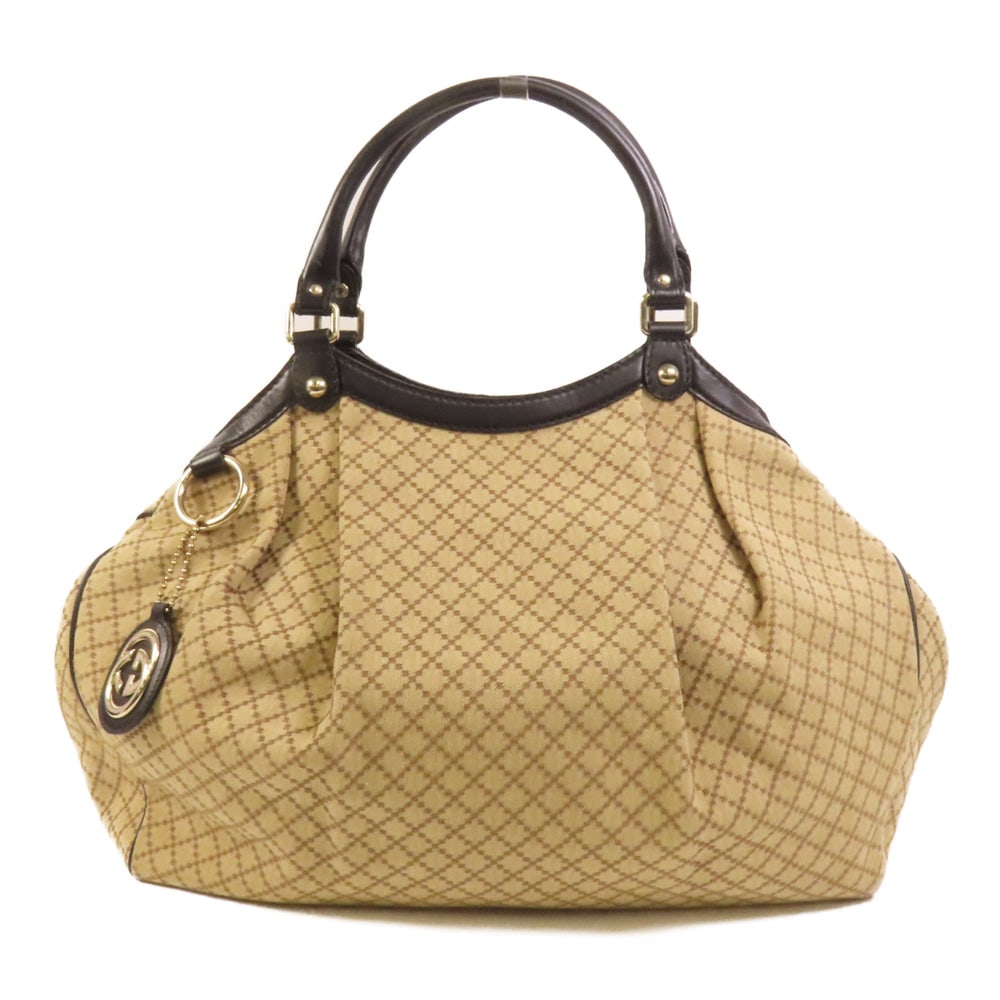 Gucci Canvas Tote Handbag Brown: Authentic and authenticated Gucci tote handbag in brown canvas. Product no. 002123. Approx. 46W x 40H x 13D cm with 38 cm handle. Includes brand tag.