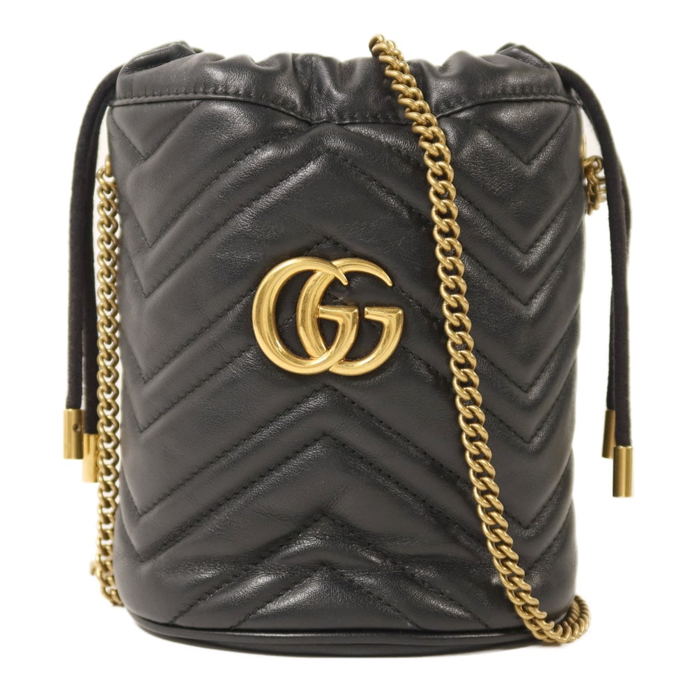 Gucci GG Marmont Bucket Bag Black: Authenticated genuine Gucci GG Marmont bucket chain shoulder bag in black calfskin leather with gold-tone hardware. Includes storage bags. Product no. 0959. Approx. W12.5 x H17 x D9 cm.
