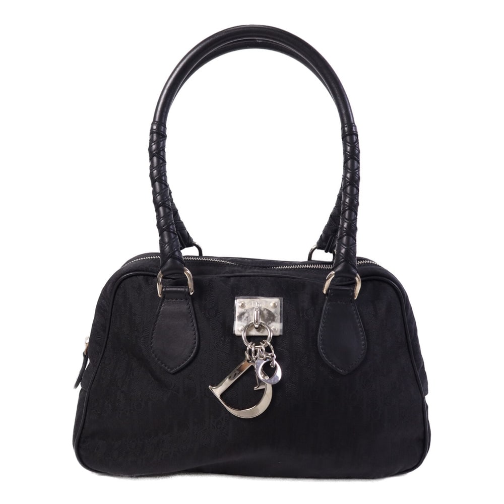 Dior Canvas Tote Bag Black: Authenticated genuine Christian Dior tote bag in black canvas with silver-tone hardware. Includes guarantee. Product no. NLC441610NO. Approx. W29 x H17.5 x D11 cm with 49 cm handle.