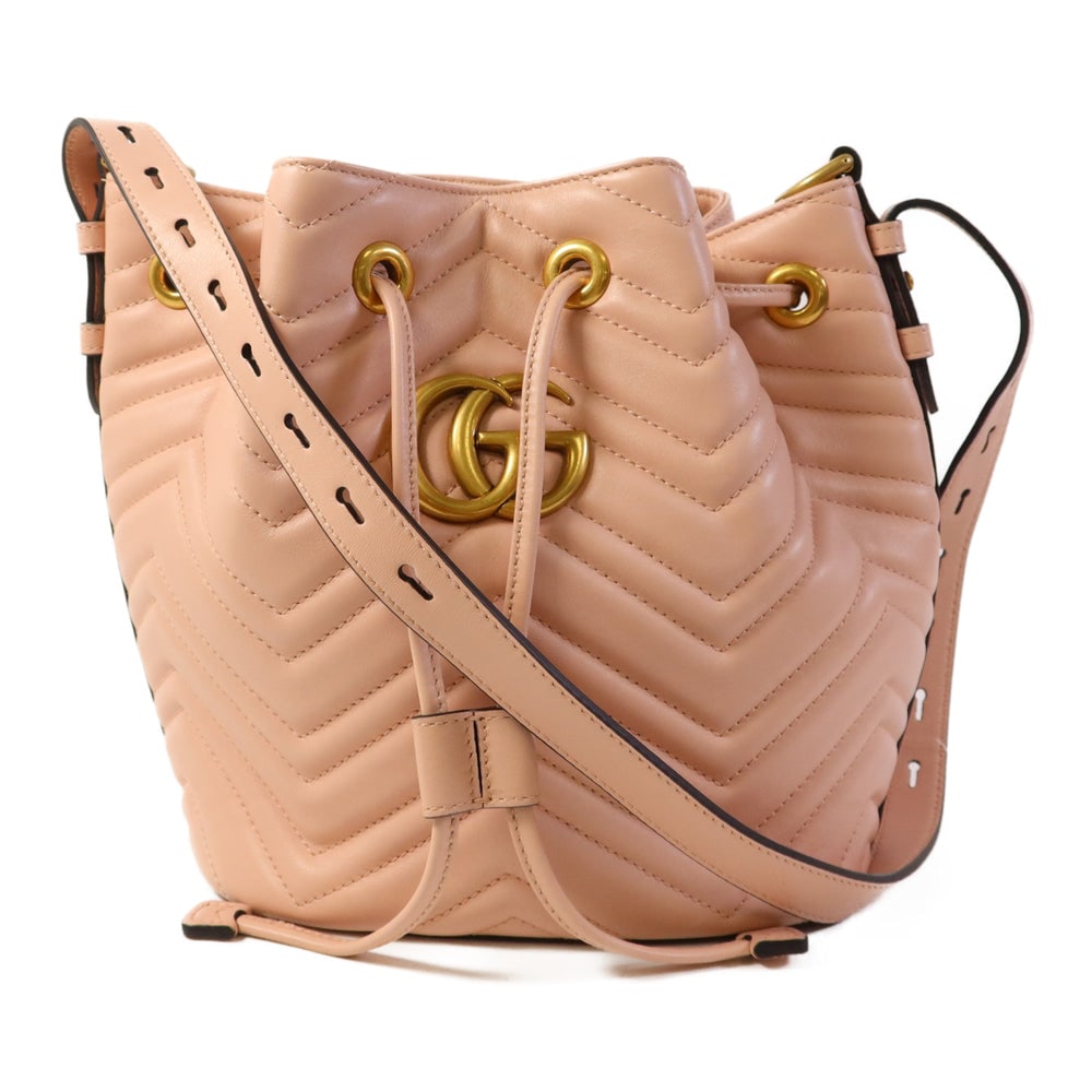 Gucci GG Marmont Bucket Bag Pink: Pink calfskin GG Marmont bucket shoulder bag with storage bags. Approx. 20.5 x 21.5 x 14.5 cm; strap 22-70 cm. Product no. 525040. Authentic and authenticated.