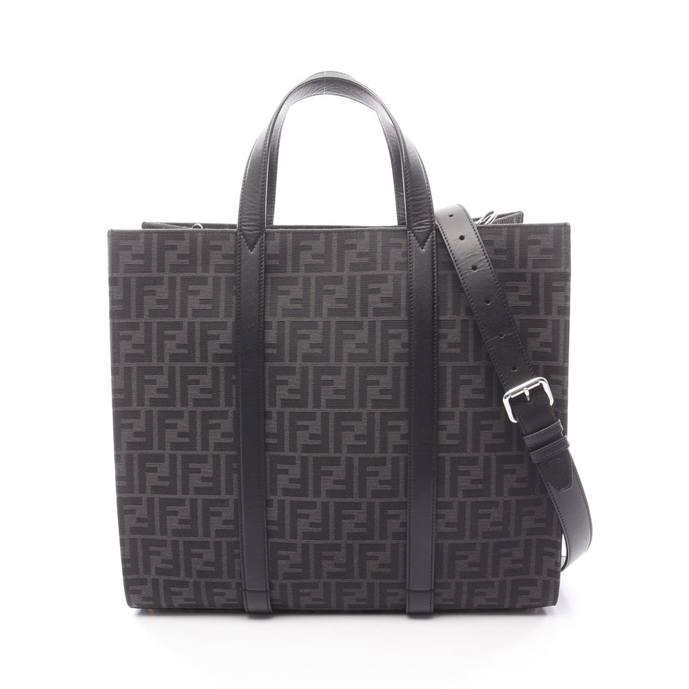 Fendi FF Jacquard 2-Way Tote Black: Black and dark gray canvas and leather FF jacquard 2-way tote. Includes shoulder strap. Approx. 39 x 35 x 19 cm; handle 36 cm; strap 123-141 cm. Model 7VA390. Authentic and authenticated.