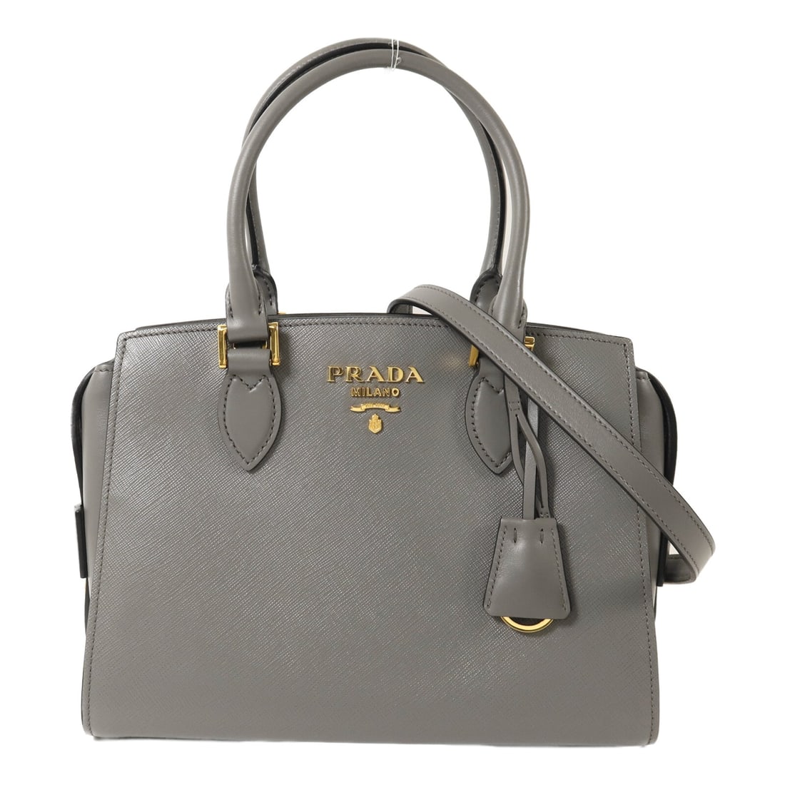 Prada Borsa A Mano Grey: Borsa A mano 2 way shoulder bag 1BA164 in grey calfskin with gold hardware. Includes storage bags, shoulder strap, and clochette. Size 26 x 20 x 13 cm.