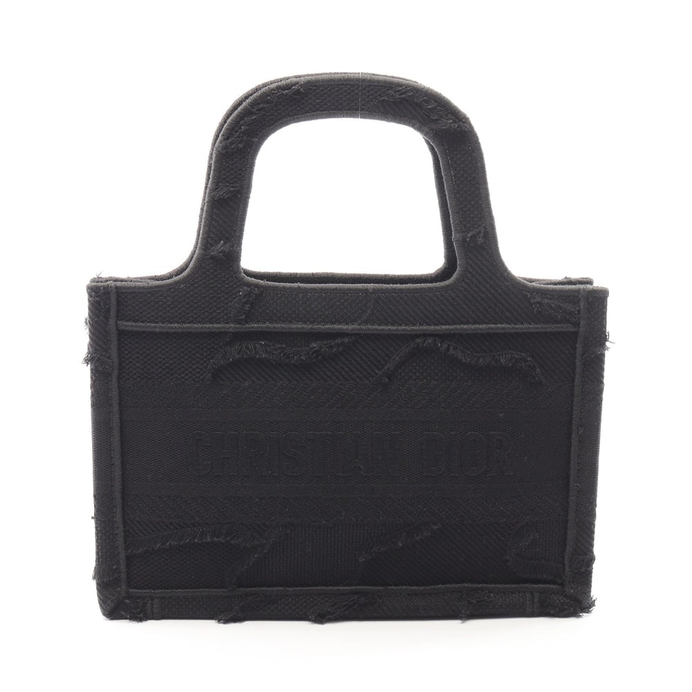 Dior Book Tote Mini Black: Black canvas Christian Dior Book Tote Mini handbag. Approx. 23 x 15 x 6 cm with 26 cm handles. Authentic and authenticated.