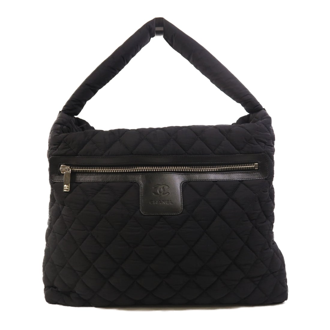 Chanel Coco Cocoon Tote Black: Coco Cocoon shoulder tote handbag in black nylon with silver hardware. Includes storage bags, hologram sticker, and guarantee. Size 41 x 33 x 11 cm.