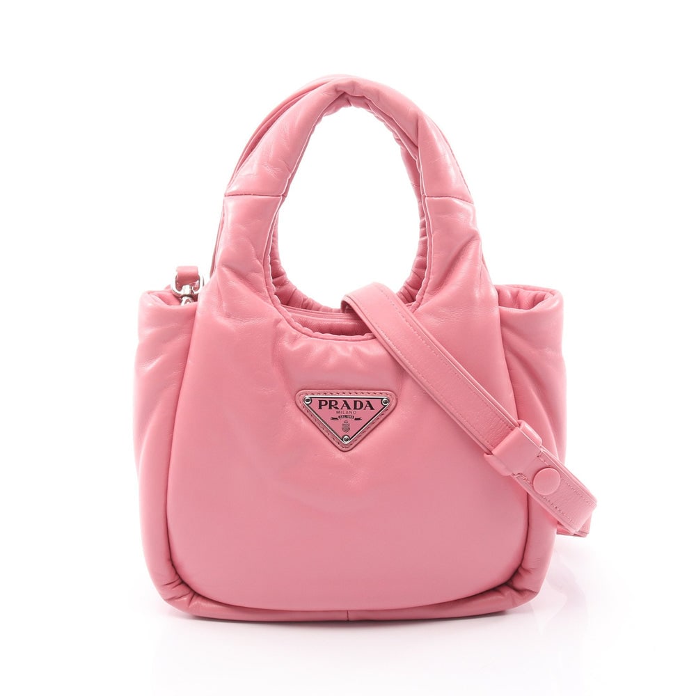 Prada Padet 2-Way Pink: Pink leather Prada Padet 2-way handbag with shoulder strap. Approx. 20.5 x 15 x 8.5 cm; handle 28 cm; strap 105-115 cm. Model 1BA359. Authentic and authenticated.