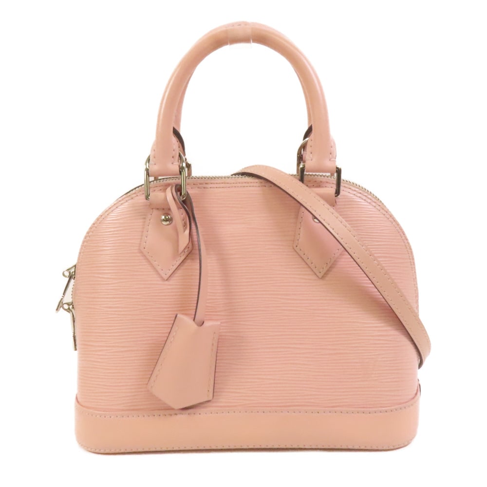 LV Alma BB Epi Pink: Pink Epi calfskin Alma BB 2-way shoulder bag with shoulder strap, clochette, keys, and padlock. Approx. 23.5 x 17.5 x 11.5 cm; handle 28 cm; strap 112 cm. Product no. SN1116. Authentic and