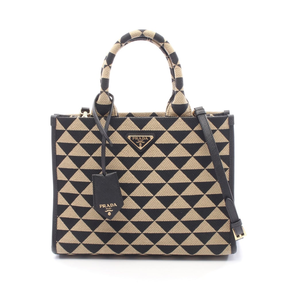 Prada Symbol Small 2-Way Beige: Beige and black canvas and leather Prada Symbol Small tote with shoulder strap and crochet key ring. Approx. 28 x 21 x 8.5 cm; handle 33 cm; strap 117-127 cm. Authentic and authenticated.