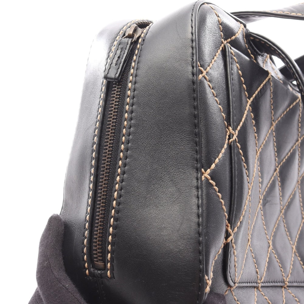 Chanel Wild Stitch Handbag: Black leather handbag with gold hardware.