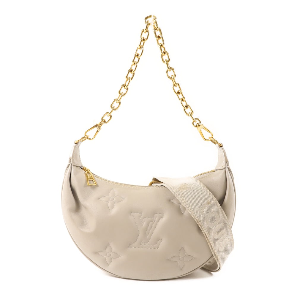 LV Over The Moon Gray: Gray Monogram Empreinte calfskin Over The Moon shoulder bag with shoulder strap. Approx. 19-28 x 18 x 7.8 cm; handle 50 cm; strap 88-119 cm. Authentic and authenticated.