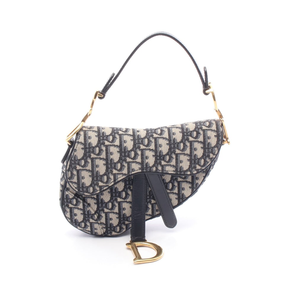 Dior Saddle Oblique Handbag: Navy and beige canvas and leather saddle handbag; H13 x W18 x D5 cm; handle 33 cm. Authentic and authenticated.