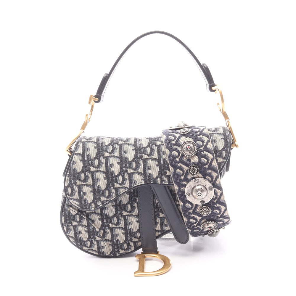 Dior Mini Saddle 2 Way: Beige and navy Oblique jacquard canvas and leather mini saddle handbag; includes shoulder strap; H13 x W18 x D5 cm. Authentic and authenticated.