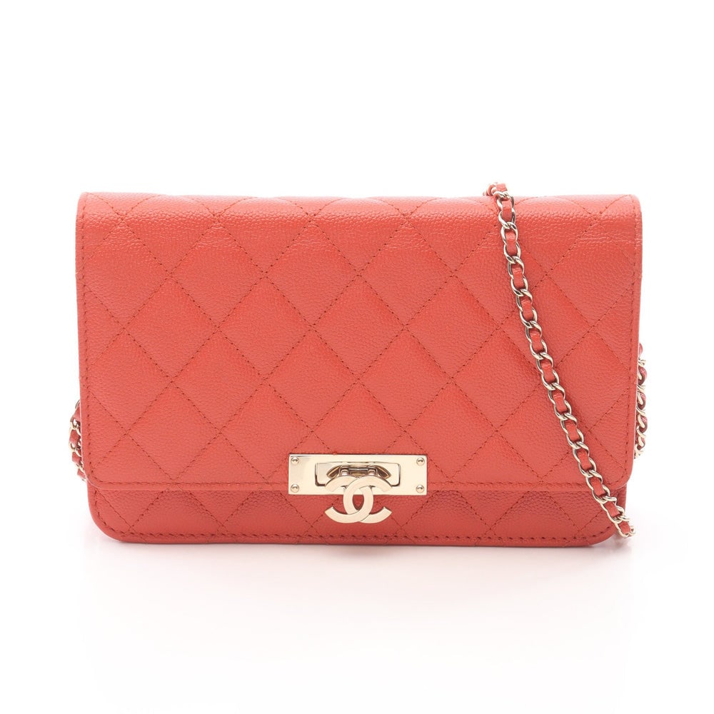 Chanel Cocorock Chain Wallet: Orange caviar skin chain wallet with gold hardware; guarantee card and serial seal included; H12.5 x W19 x D3.5 cm. Authentic and authenticated.