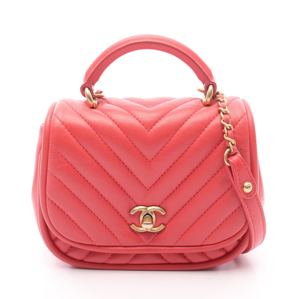 Chanel Chevron V-Stitch Coral Bag: Coral pink lambskin 2 way chain shoulder bag with gold hardware; guarantee card and serial seal included; H13.5 x W16/17 x D6.5 cm. Authentic and authenticated.