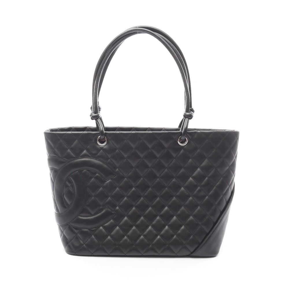 Chanel Cambon Line Large Tote: Black lambskin Cambon line large tote with silver hardware; serial seal and boutique seal included; H25 x W38/30 x D15 cm. Authentic and authenticated.