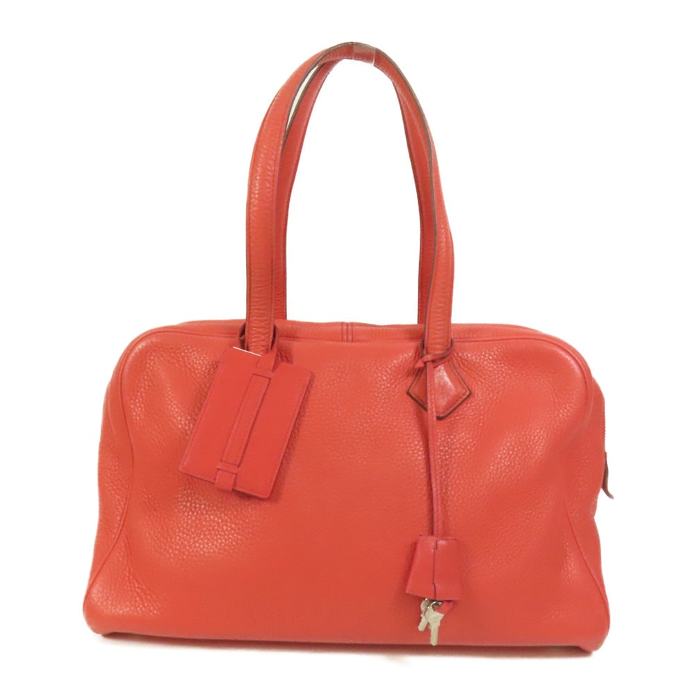 Hermes Victoria 35 Rouge Pivoine: Rouge pivoine Taurillon Clemence leather handbag with PHW; includes clochette, key, and name tag; W35 x H23 x D17.5 cm. Authentic and authenticated.