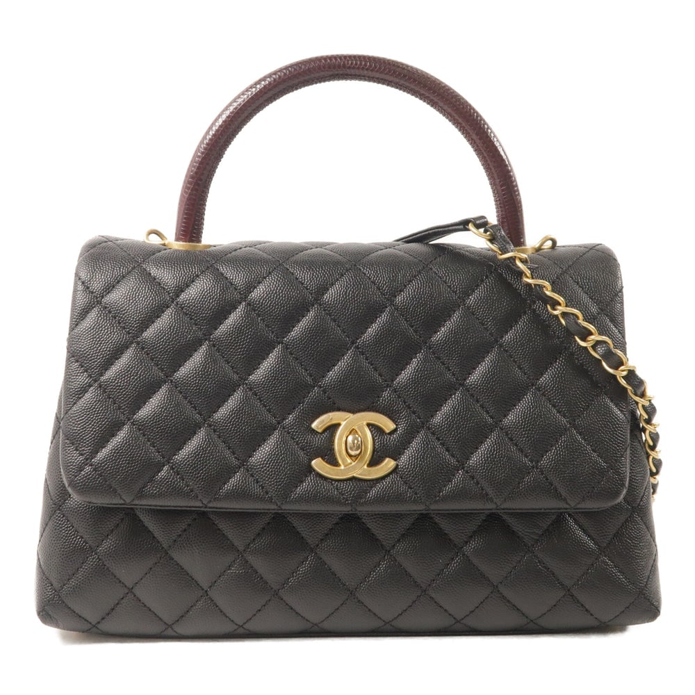 Chanel Coco Handle Medium Black: Black calfskin and lizard leather Coco Handle medium 2-way bag.