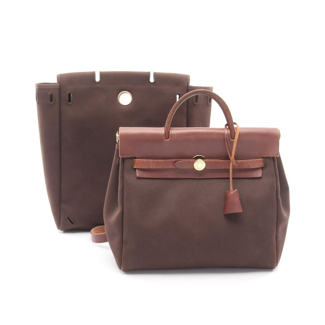 Hermes HerBag Ad PM Backpack: Authentic and authenticated Hermes HerBag Ad PM Marron Havana backpack in dark brown and brown Toile Officier Vache hunter with gold hardware. Approx. 27H x 27/28W x 11D cm. Includes padlock, 2 keys,