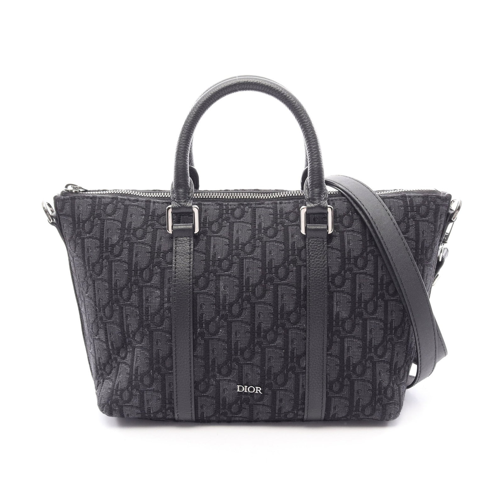 Dior Weekender 25 Oblique 2WAY: Authentic and authenticated Christian Dior Weekender 25 Oblique 2WAY handbag in dark navy and black canvas leather. Model 1ESPO322YKY. Approx. 18H x 31/23W x 12D cm with strap and 29 cm handle.