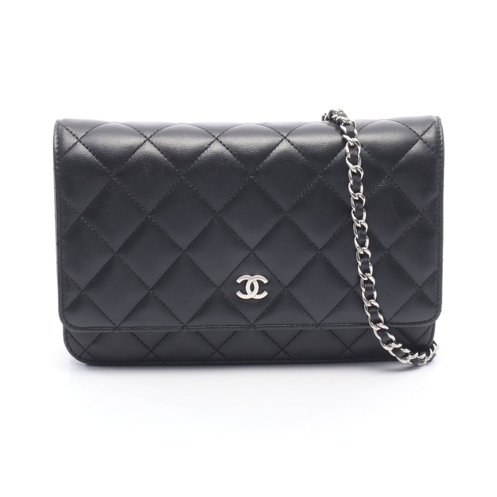 Chanel Chain Wallet Black Lambskin: Authentic and authenticated Chanel Matelasse chain wallet in black lambskin with silver hardware. Model AP0250. Approx. 12H x 19W x 3.5D cm with 122 cm strap. Includes guarantee card, serial seal,